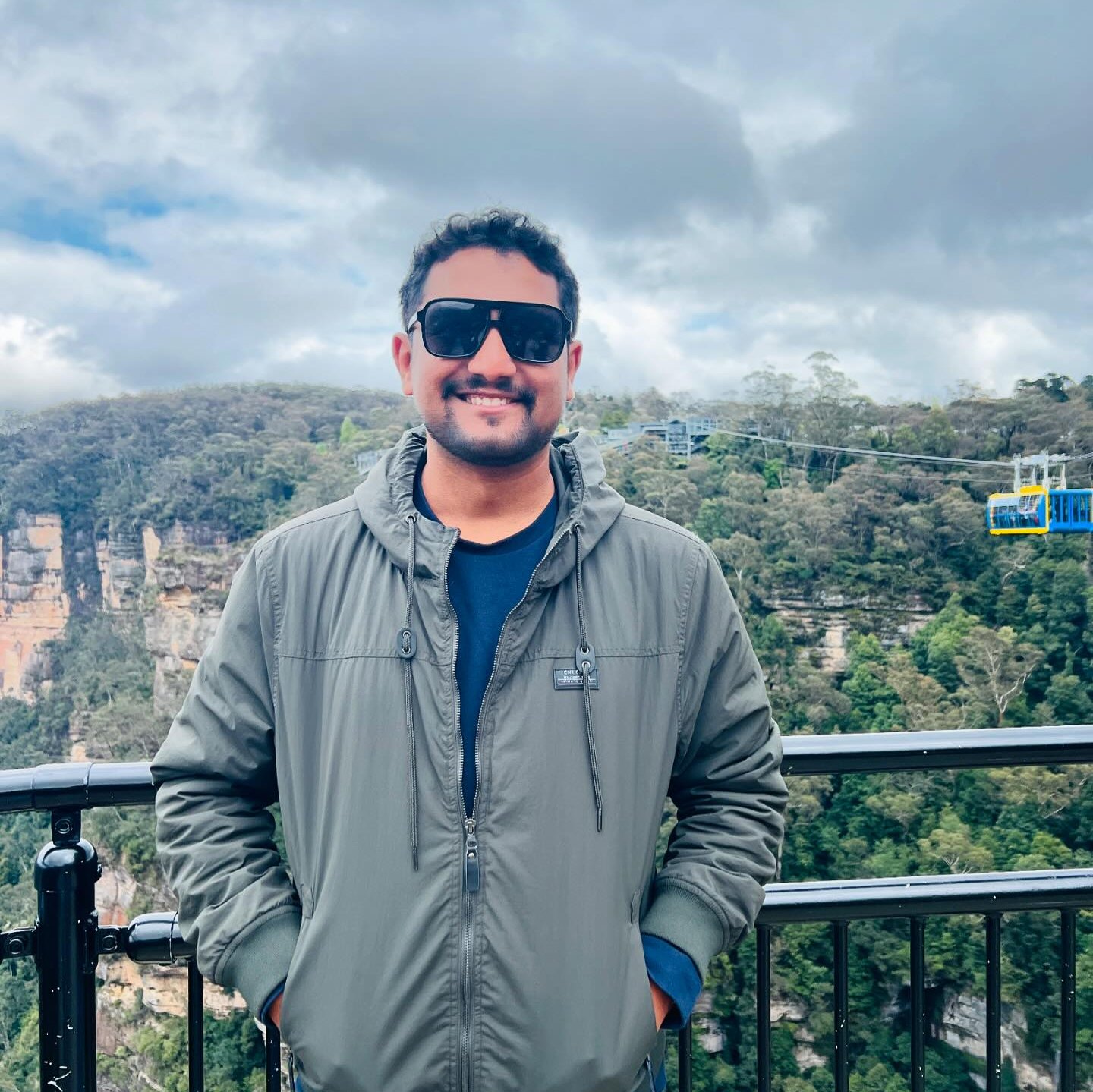 A portrait of Pujan Thapa